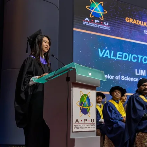 Lim Jia Yong speaking at a podium